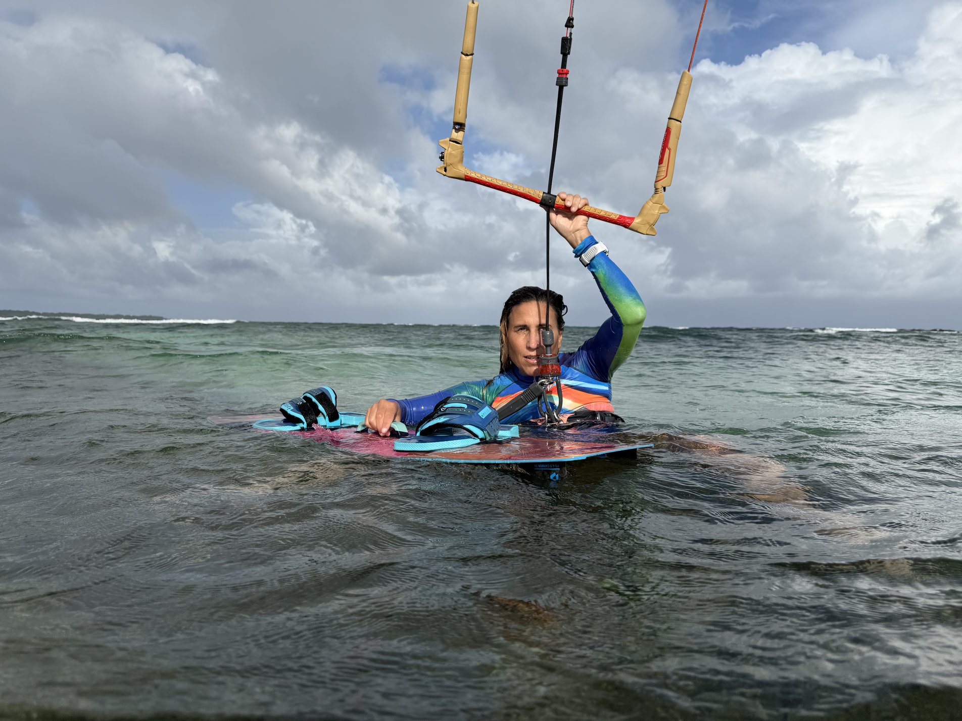 Sophie in the water with her board, ready for a water start